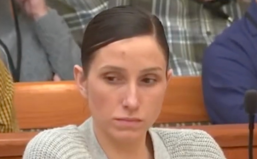 Clear portrait photo of woman, likely Kouri Richins, in professional/casual setting