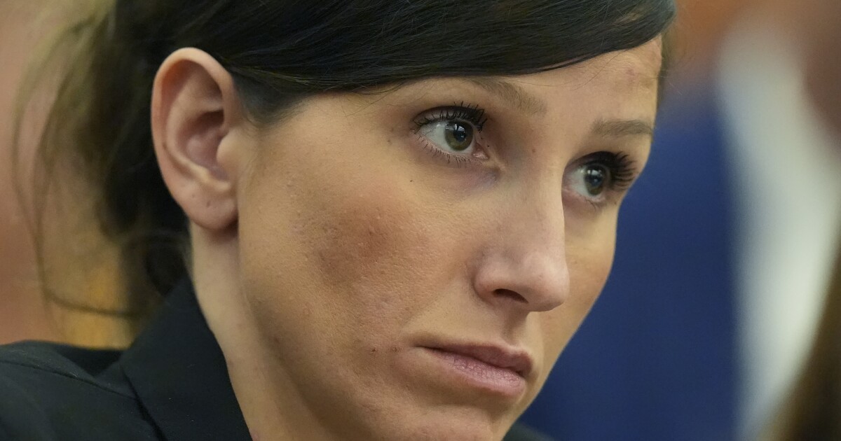 Clear portrait photo of woman in military or formal attire, likely Kouri Richins