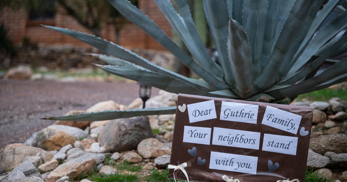 Exterior of Nancy Guthrie's home with family members gathered outside, showing tribute setup