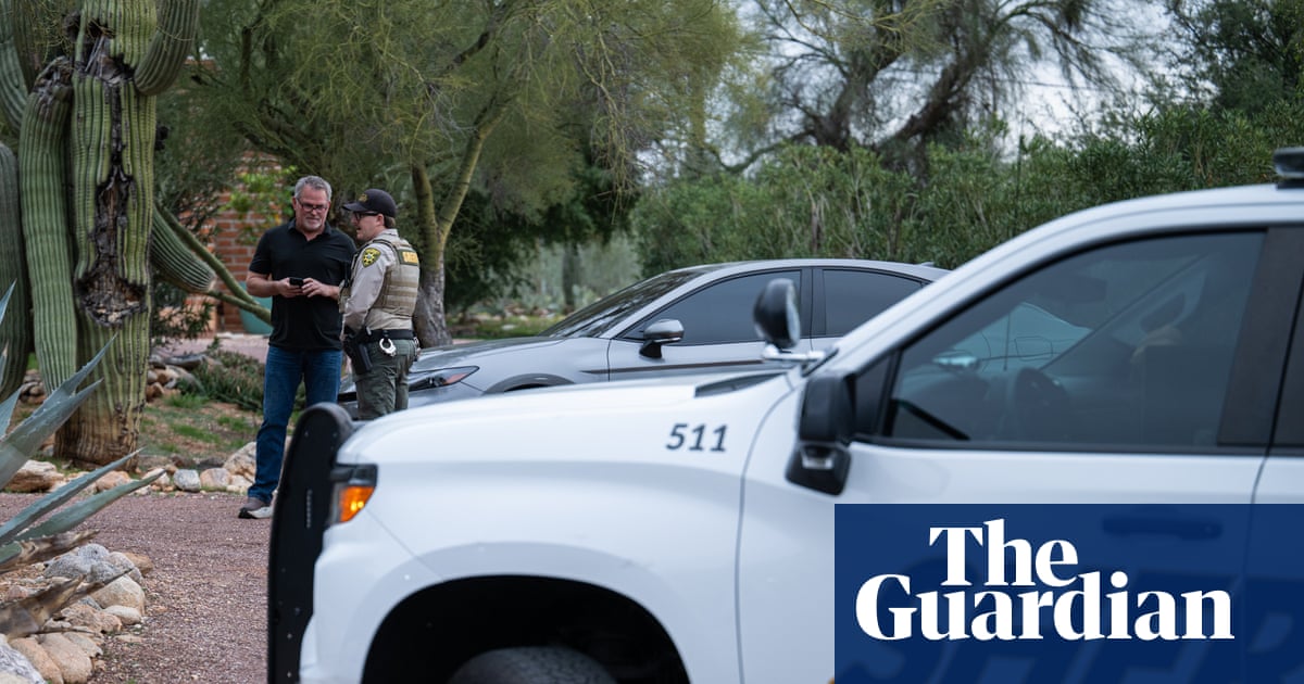 Law enforcement personnel and vehicles at a location, appears to be search or investigation activity with white van