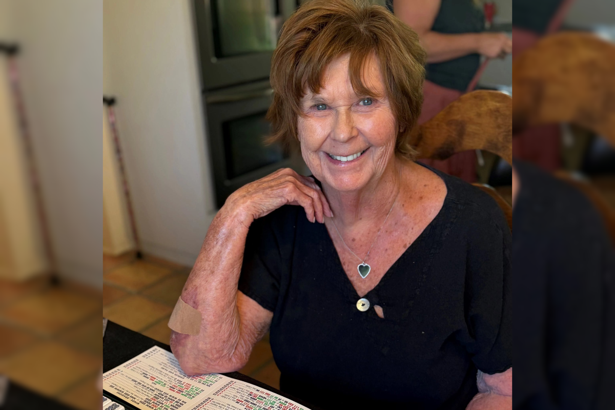 Close-up portrait of Nancy Guthrie, older woman with gray/brown hair, smiling at camera, indoor setting