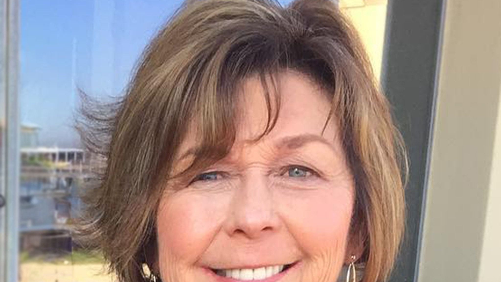 Clear portrait photo of Nancy Guthrie, smiling woman with blonde/light brown hair