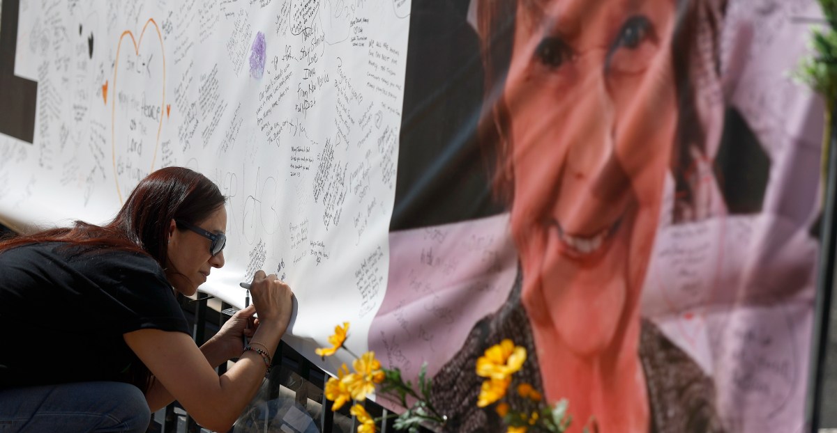 Memorial setup with flowers, candles and items in tribute to Nancy Guthrie